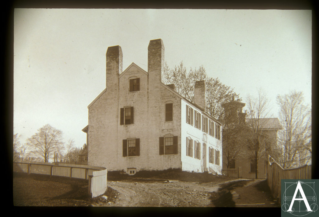 late 19th century-view of the Wade House showing it fully coated in a light color, probably white 