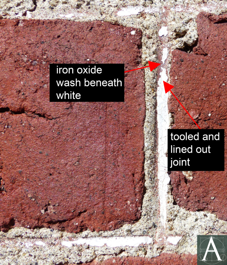 detail of brickwork showing remains of original joint detail with white lining applied over a wash of iron oxide