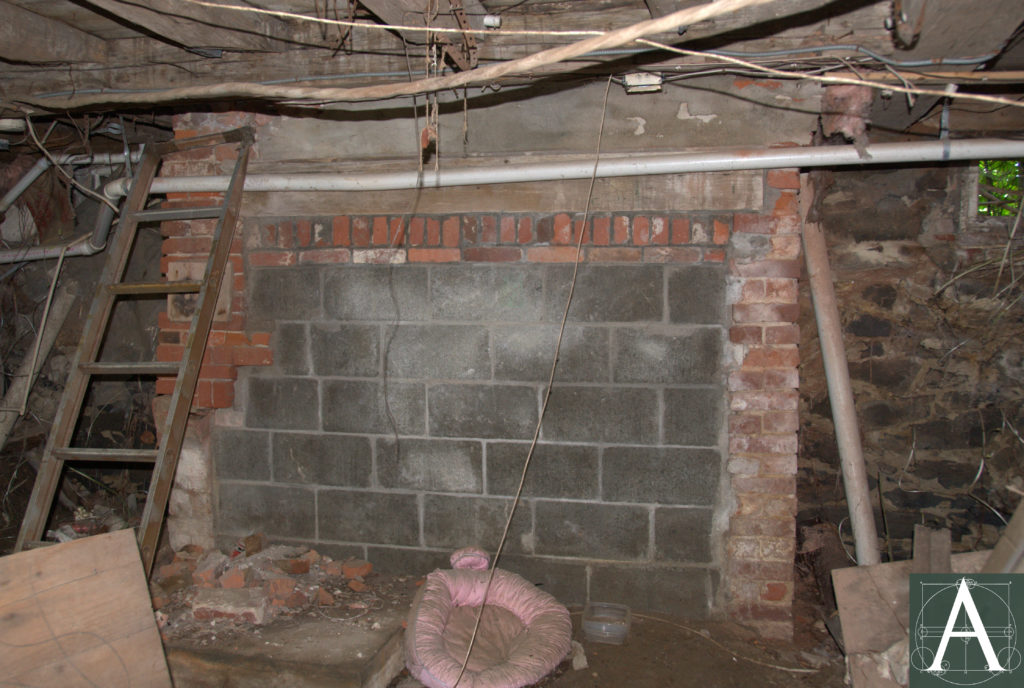 fragmentary remains of cellar cooking hearth