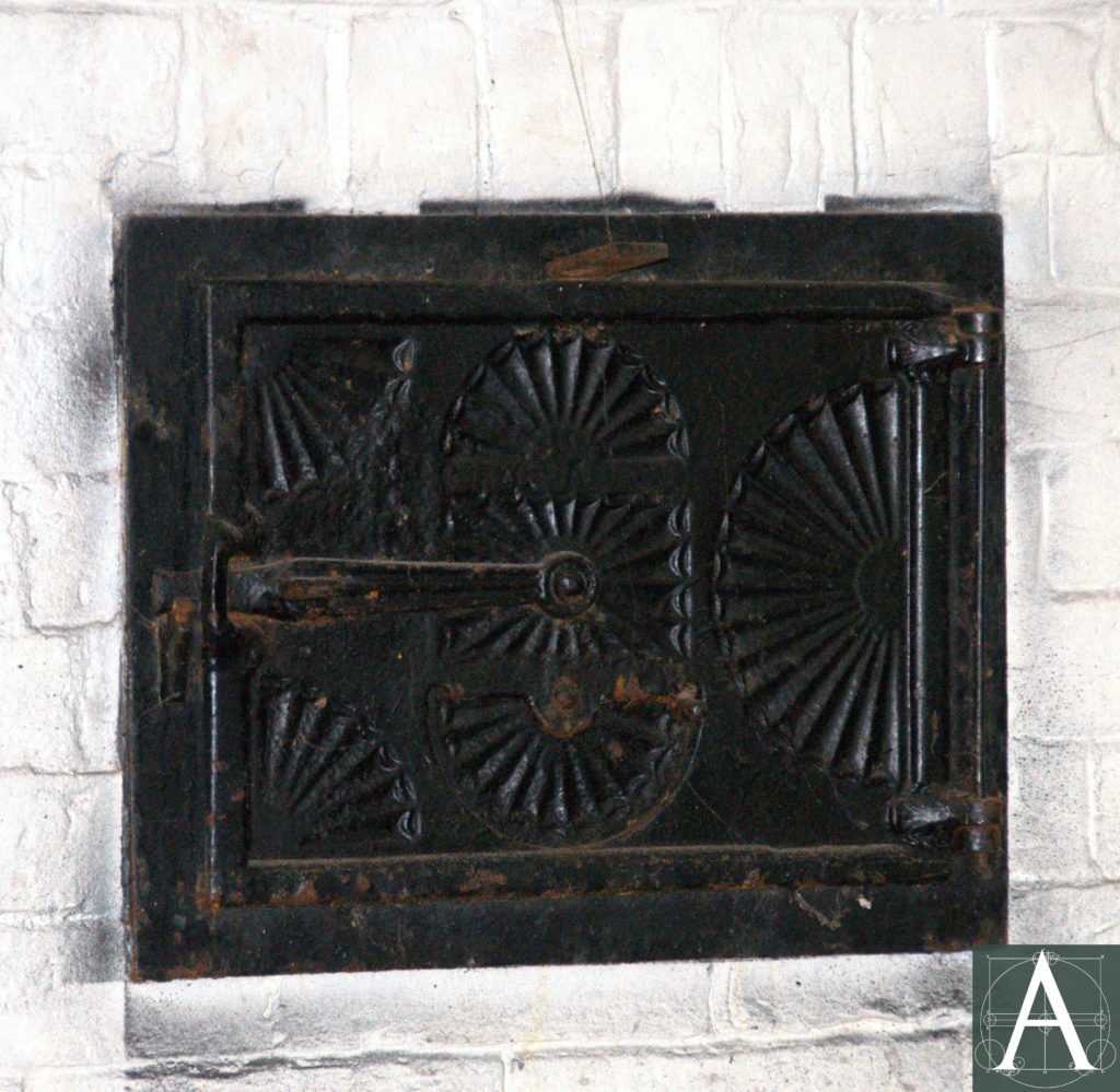 typical Federal-style cast-iron door at brick oven of first-storey cooking hearth