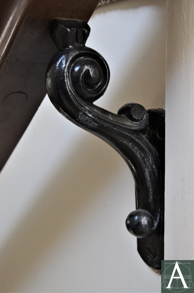 Cast iron bracket for the handrail at the main staircase